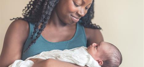 new-mom-holding-infant-daughter